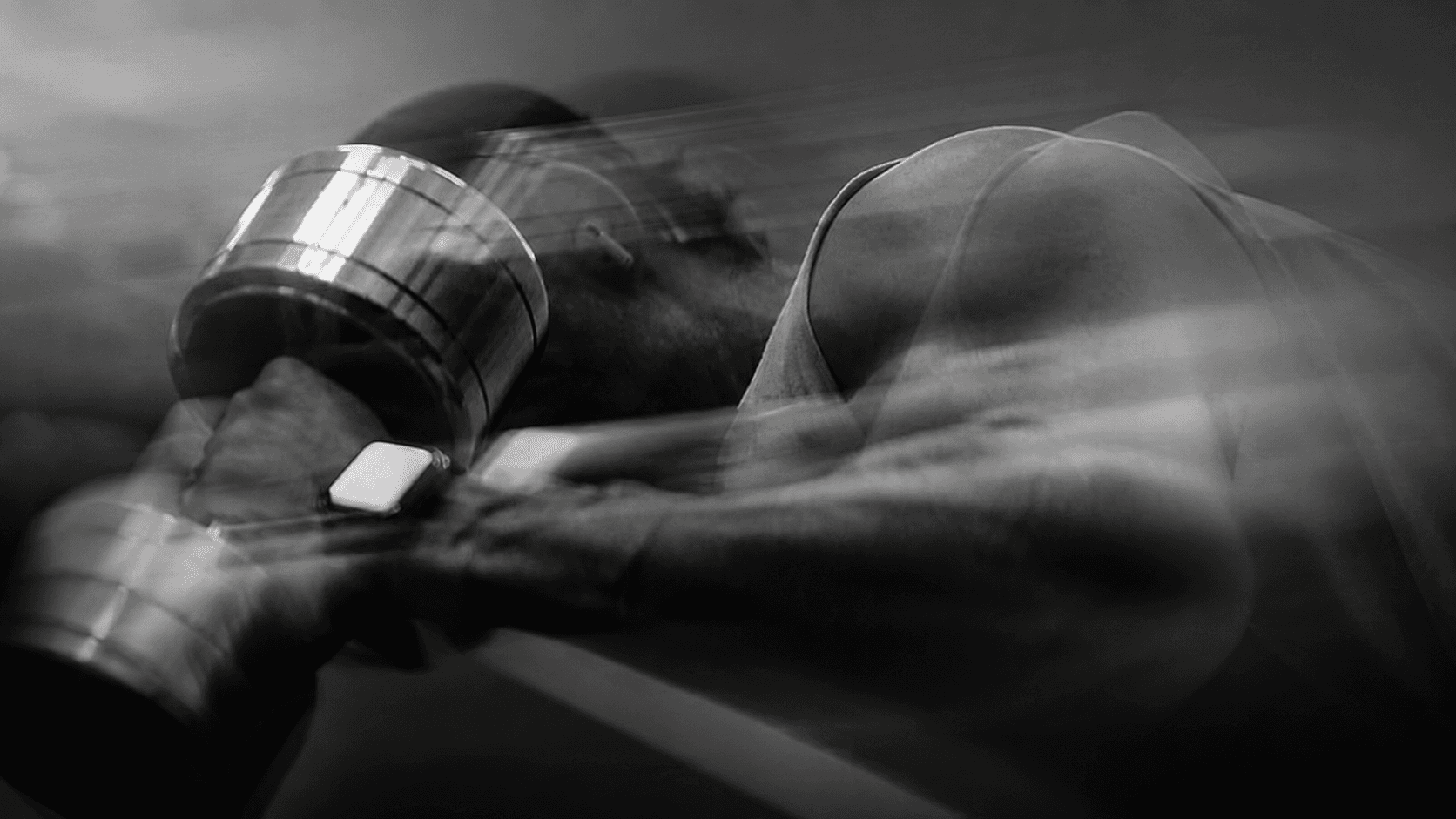 Athlete training with a dumbbell